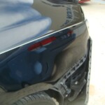 Before and after photographs of a damaged black Volkswagon Jetta that was repaired by Elite Paint & Body Shop in West Palm Beach, Florida.